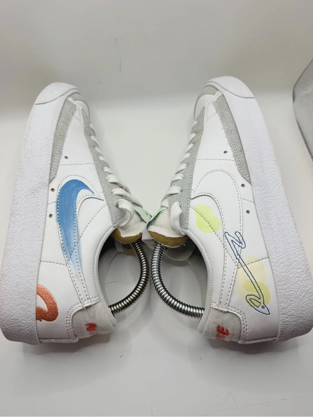 Nike White Low-Top Sneakers with Blue, Green, Yellow and Orange Accents